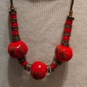Vintage elegant 1960s red tribal round bead with metal rings necklace.